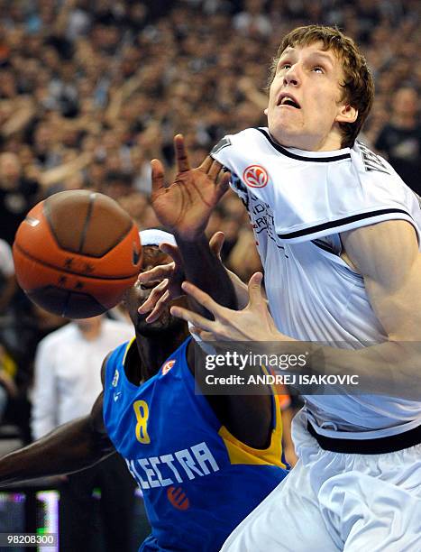 Jan Vesely of Partizan Belgrade vies with Doron Perkins of Maccabi Tel Aviv during their teams fourth Euroleague quarterfinal match in Belgrade Arena...