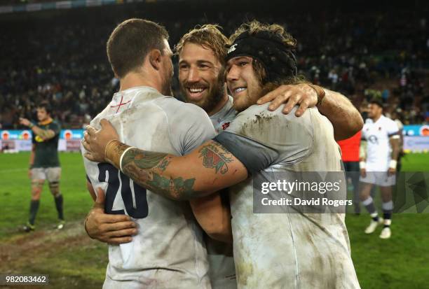Mark Wilson Chris Robshaw and Harry Williams celebrate their victory during the third test match between South Africa and England at Newlands Stadium...