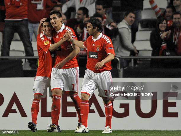 Benfica's Paraguayan forward Oscar Cardozo celebrates with teammates forward Nuno Gomes and Argentinian forward Angel Di Maria after scoring against...