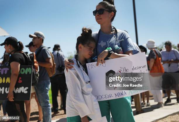 Sara Del Campo De Gonzalez, MD. And her daughter Citlalli Gonzalez join with other health care professionals to protest outside the tent encampment...