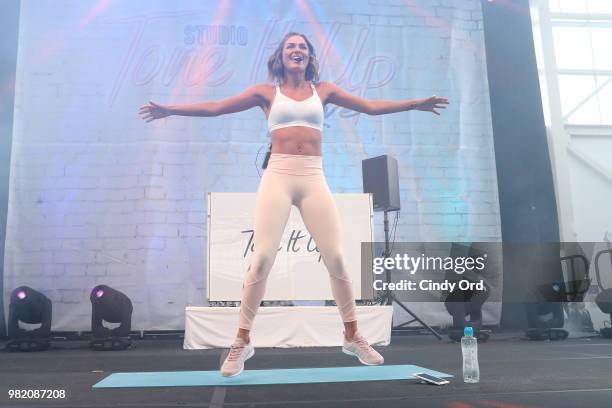 Tori Simeone leads yoga on stage at the Studio Tone It Up Live! at Duggal Greenhouse on June 23, 2018 in Brooklyn, New York.