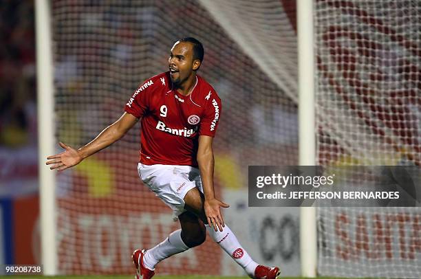 Brazil's Internacional footballer Alecsandro celebrates his goal against Uruguay's Cerro, during their Libertadores Cup football match at Beira Rio...