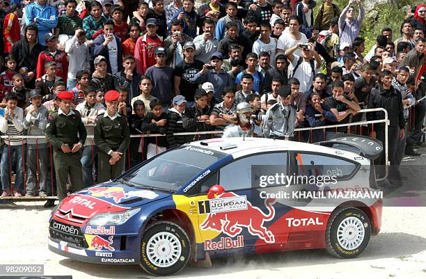 Citroen C4 driver Sebastien Loeb of France and co-driver Daniel Elena of Monaco take off at the start of the Jordan Rally of the FIA World Rally...