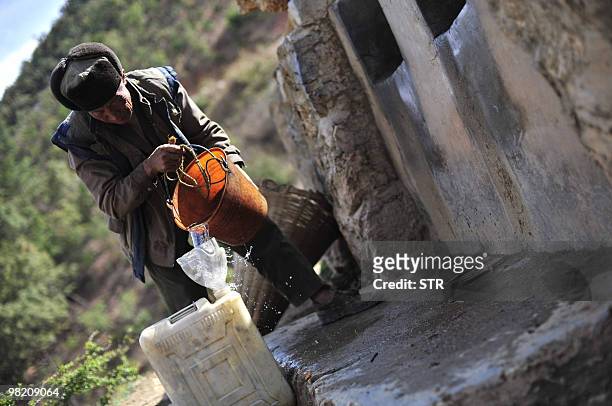 Man collects water during a severe drought in Kunming, southwest China's Yunnan province on March 31, 2010. China said that more than 24 million...