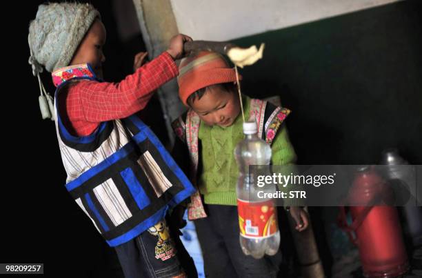 Two boys prepare to collect water during a severe drought in Kunming, southwest China's Yunnan province on March 31, 2010. China said that more than...