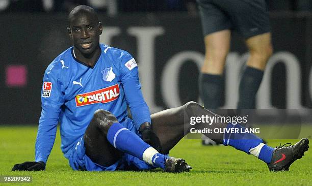 Picture taken on November 29, 2008 shows Hoffenheim's Senegalese striker Demba Ba sitting on the pitch during the Bundesliga football match of TSG...