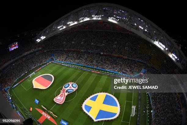 The German and Swedish national flags are pictured during the Russia 2018 World Cup Group F football match between Germany and Sweden at the Fisht...