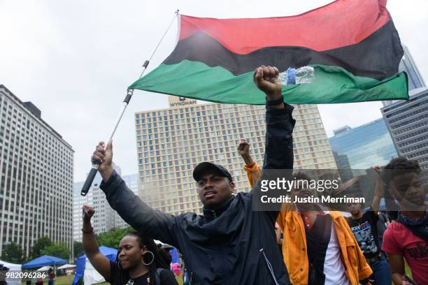 Jomar Davis of Wilkinsburg, Pa., joins a march for the police shooting of Antwon Rose during a Juneteenth celebration on June 23, 2018 in Pittsburgh,...