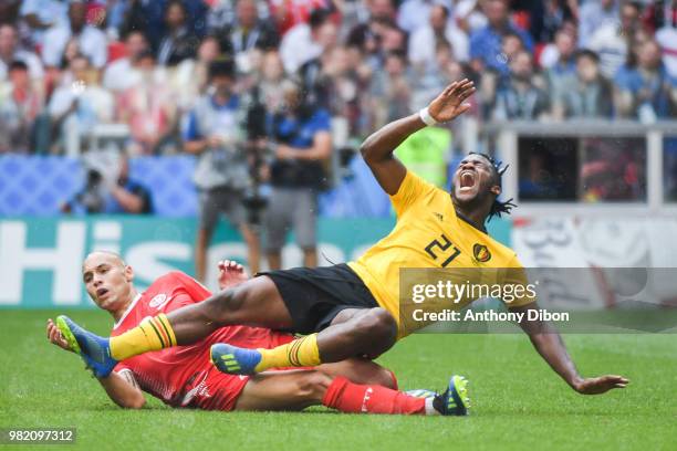 Michy Batshuayi of Belgium is tackle by Yohan Benalouane of Tunisia during the FIFA World Cup Group G match between Belgium and Tunisia at Spartak...