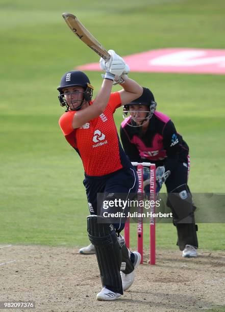 Katey Martin of New Zealand looks on as Nat Sciver of England hits out during the International T20 Tri-Series match between England Women and New...