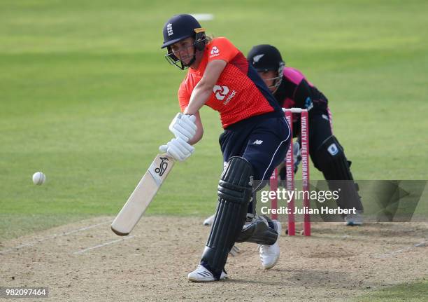 Katey Martin of New Zealand looks on as Nat Sciver of England hits out during the International T20 Tri-Series match between England Women and New...