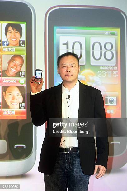 Peter Chou, president and chief executive officer of HTC Corp., holds the HTC Smart smartphone during the unveiling in Taipei, Taiwan, on Friday,...