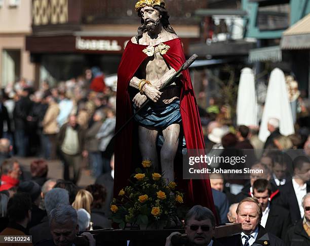 Catholic believers flock the road during a Good Friday procession on April 2, 2010 in Lohr am Main, Germany. Several thousands of faithful took part...