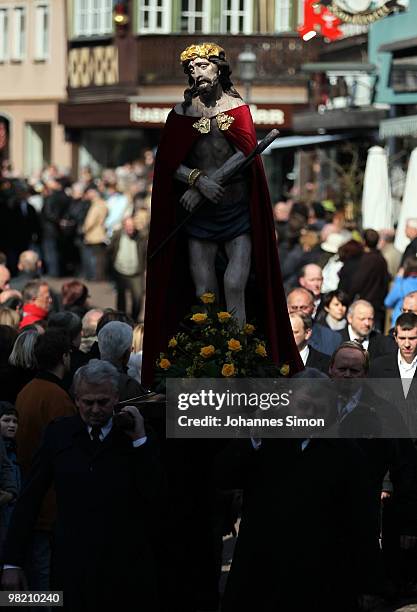 Catholic believers flock the road during a Good Friday procession on April 2, 2010 in Lohr am Main, Germany. Several thousands of faithful took part...