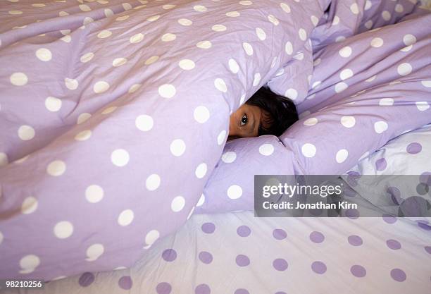 dreamy eyed girl in bed.  - duvet fotografías e imágenes de stock