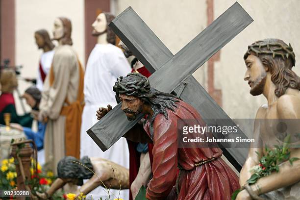 Wooden sculptures referring to the passion of Christ are displayed ahead of a Good Friday procession on April 2, 2010 in Lohr am Main, Germany....