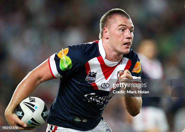 Shaun Kenny-Dowall of the Roosters runs the ball during the round four NRL match between the Sydney Roosters and the Brisbane Broncos at Sydney...