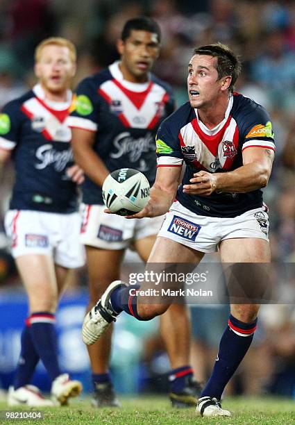 Mitchell Pearce of the Roosters passes during the round four NRL match between the Sydney Roosters and the Brisbane Broncos at Sydney Football...