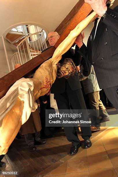 Wooden sculptures, depicting Jesus Christ are brought back into the church after a Good Friday procession on April 2, 2010 in Lohr am Main, Germany....