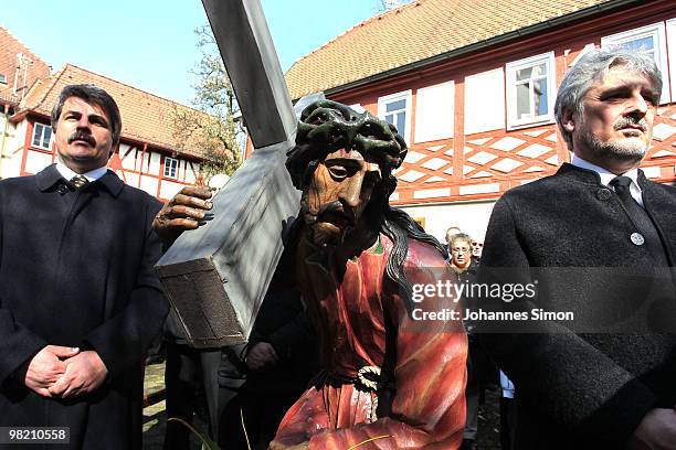 Catholic believers flock the road during a Good Friday procession on April 2, 2010 in Lohr am Main, Germany. Several thousands of faithful took part...