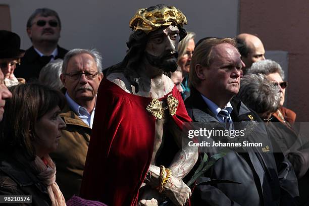 Catholic believers flock the road during a Good Friday procession on April 2, 2010 in Lohr am Main, Germany. Several thousands of faithful took part...