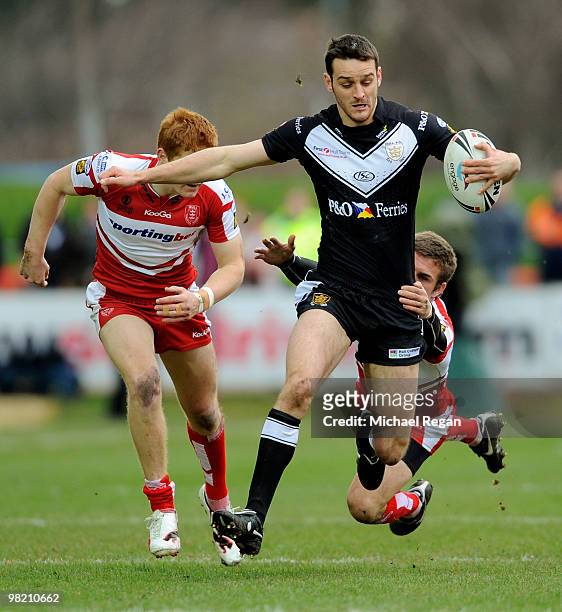 Craig Hall of Hull FC is tackled by Ben Cockayne of Hull KR during the engage Super League match between Hull Kingston Rovers and Hull FC at Craven...