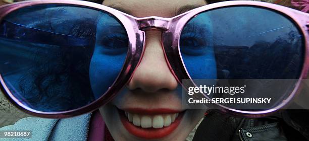 Clown performs during the traditional march through central Kiev to mark April Fool's Day on April 1, 2010. AFP PHOTO/ SERGEI SUPINSKY