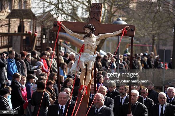 Catholic believers flock the road during a Good Friday procession on April 2, 2010 in Lohr am Main, Germany. Several thousands of faithful took part...