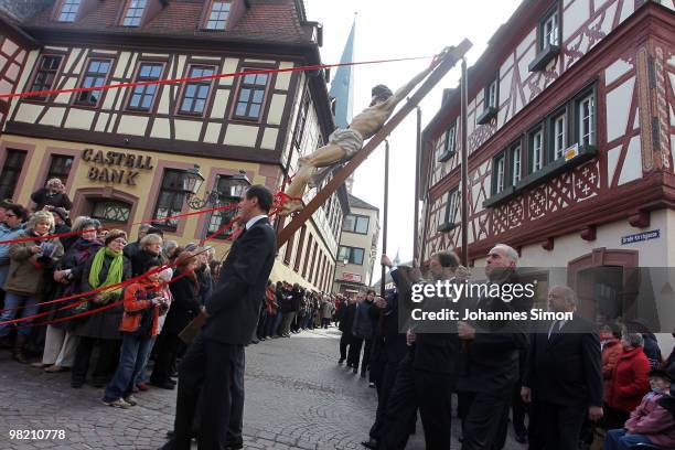 Catholic believers flock the road during a Good Friday procession on April 2, 2010 in Lohr am Main, Germany. Several thousands of faithful took part...