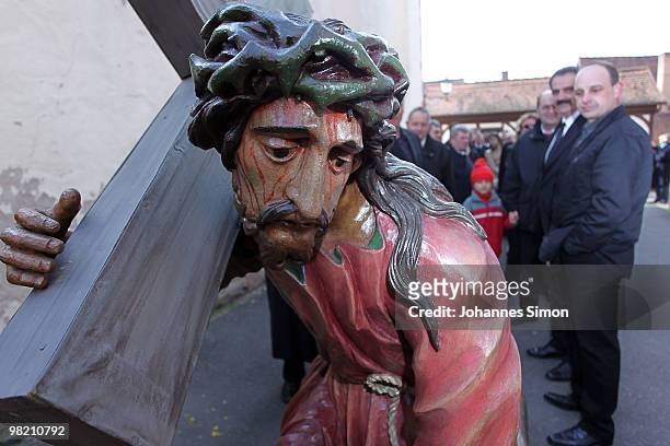 Wooden sculpture depicting Jesus Christ is displayed ahead of a Good Friday procession on April 2, 2010 in Lohr am Main, Germany. Several thousands...