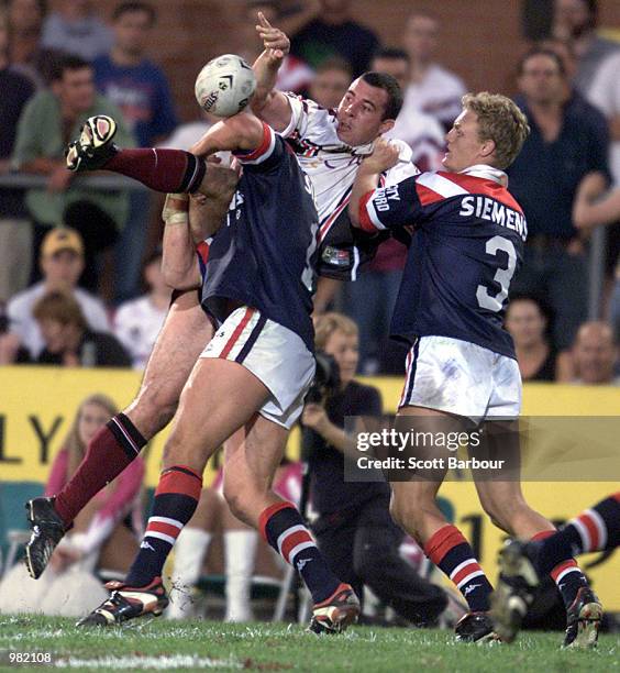 Wayne Evans of the Northern Eagles is tackled by Ryan Cross of the Sydney Roosters during Round Five of the National Rugby League played at the...