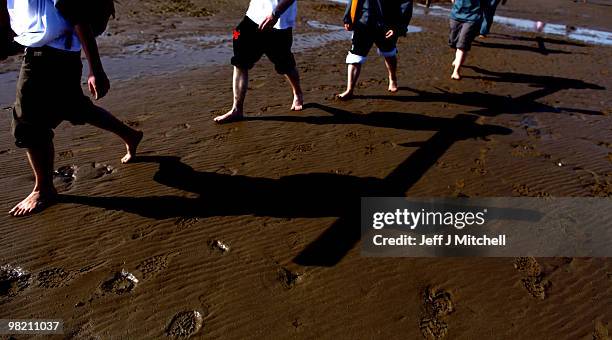 Pilgrims walk with crosses as the Northern Cross pilgrimage makes its final leg of the journey to Holy Island on April 2, 2010 in Berwick-upon-Tweed,...