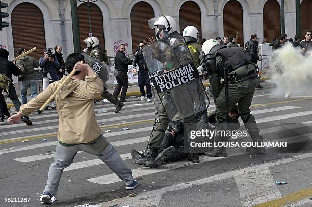 Demonstrators clash with police outside the Greek parliament in Athens on March 5, 2010. Greek police fired tear gas and clashed with protesters...