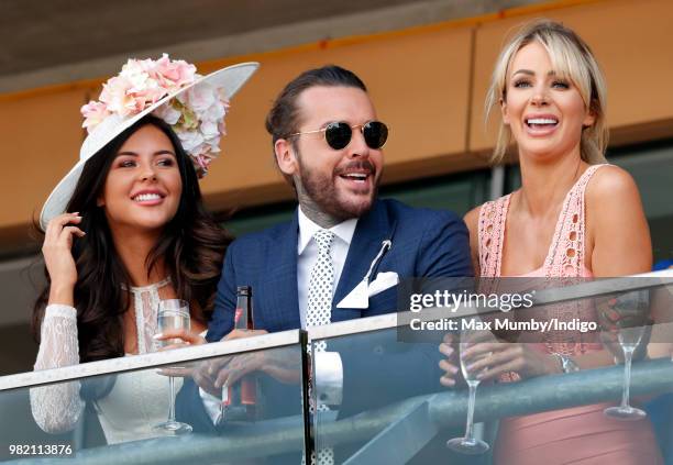 Shelby Tribble, Pete Wicks and Olivia Attwood watch the racing as they attend day 3 'Ladies Day' of Royal Ascot at Ascot Racecourse on June 21, 2018...