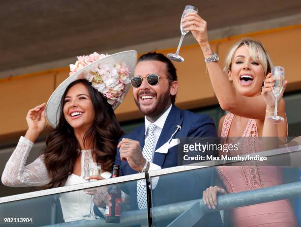 Shelby Tribble, Pete Wicks and Olivia Attwood watch the racing as they attend day 3 'Ladies Day' of Royal Ascot at Ascot Racecourse on June 21, 2018...