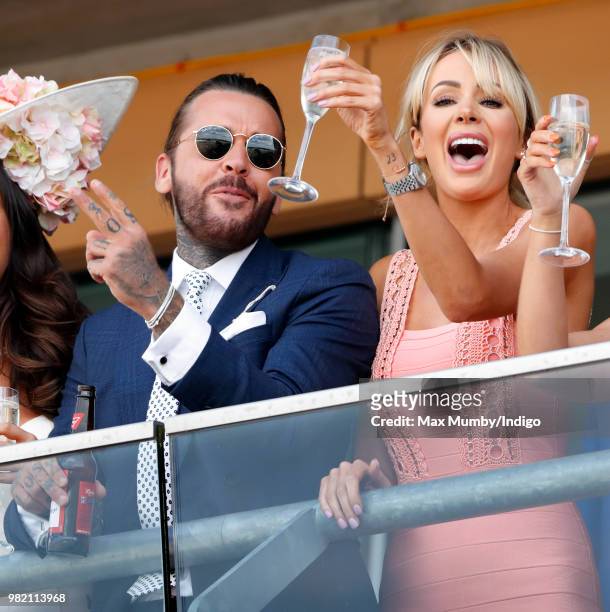 Pete Wicks and Olivia Attwood watch the racing as they attend day 3 'Ladies Day' of Royal Ascot at Ascot Racecourse on June 21, 2018 in Ascot,...