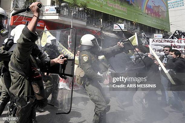 Riot police clash with demonstrators in Athens on March 11 2010, during the 24-hours general strike to protest the government's austerity plan to...