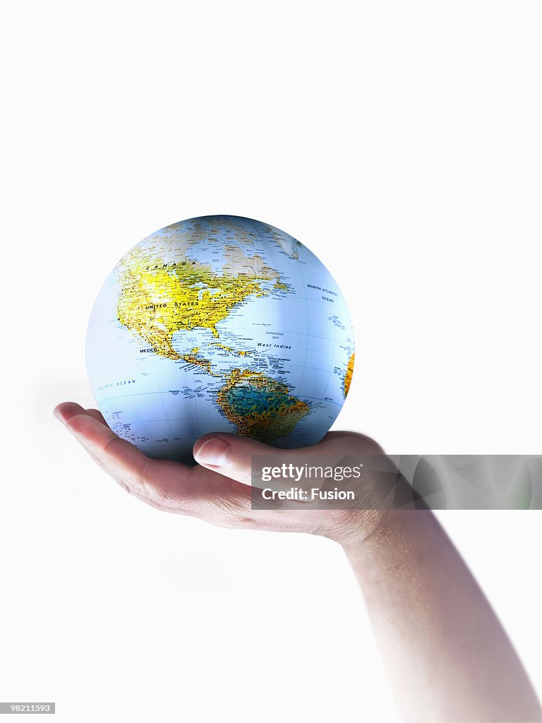 Hand Holding Globe Of Earth