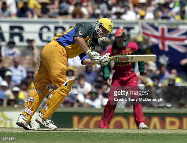 Adam Gilchrist of Australia scores through mid wicket against Zimbabwe during the Carlton Series One Day International between Australia and Zimbabwe...