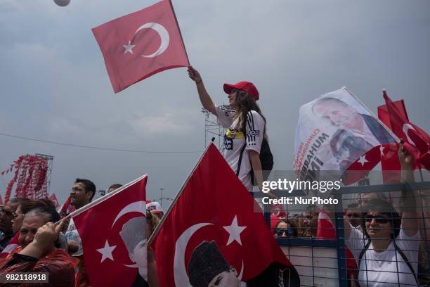 Supporters wave flags and cheer while listening to Muharrem Ince, presidential candidate of Turkey's main opposition Republican People's Party speak...