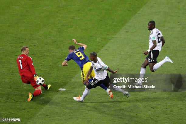 Marcus Berg of Sweden goes down in the penalty area from challenge from Jerome Boateng of Germany as Manuel Neuer makes a save during the 2018 FIFA...