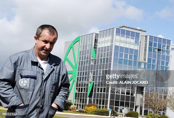 An employee of the Heuliez factory walks in front of the site in Cerizay, western France, on March 31 after Turkish investor Alphan Manas offered...