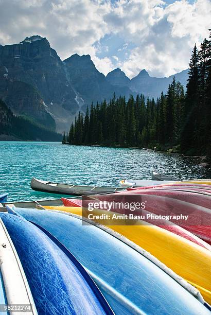 colorful boats on moraine lake - amit basu stockfoto's en -beelden