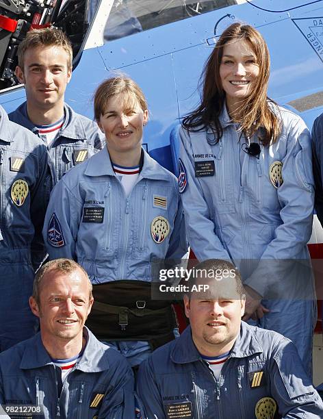 France's first lady Carla Bruni-Sarkozy , patron of the French aerobatic squadron "Patrouille de France" stands next to its leader Captain Virginie...