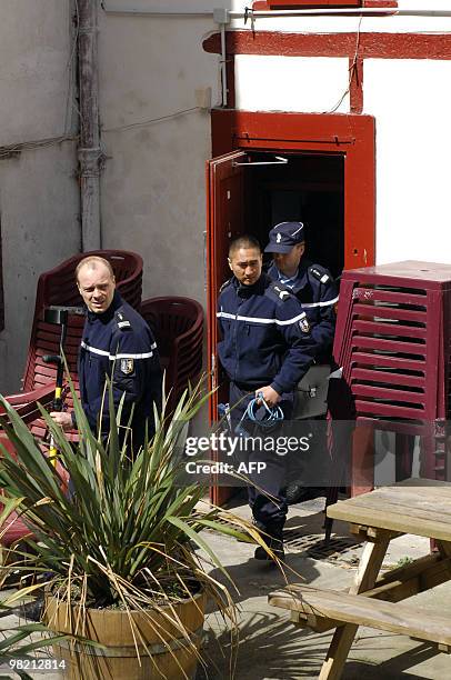 French policemen leave the headquarters of EHZ association on March 30, 2010 in Hasparren, southwestern France after a search following the arrest of...