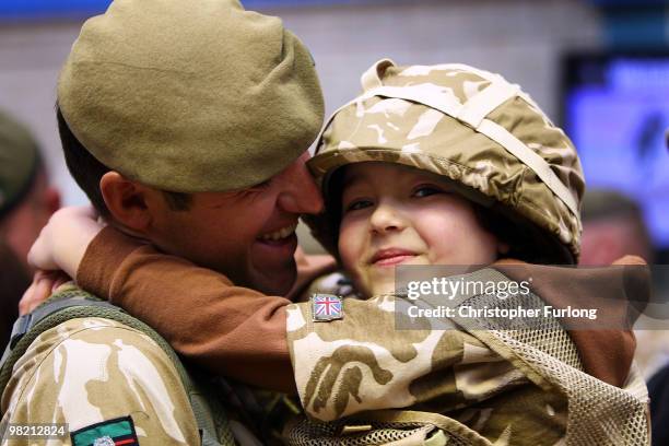 Five-year-old Ashton Peterson welcomes home his father Sergeant Carl Peterson, of 2nd Battalion The Yorkshire Regiment , as he returns from...