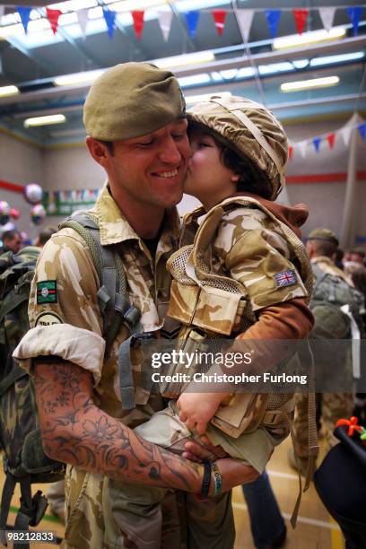 Five-year-old Ashton Peterson welcomes home his father Sergeant Carl Peterson, of 2nd Battalion The Yorkshire Regiment , as he returns from...