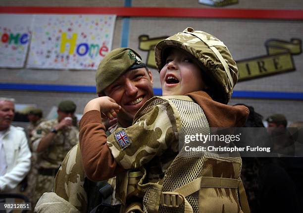 Five-year-old Ashton Peterson welcomes home his father Sergeant Carl Peterson, of 2nd Battalion The Yorkshire Regiment , as he returns from...