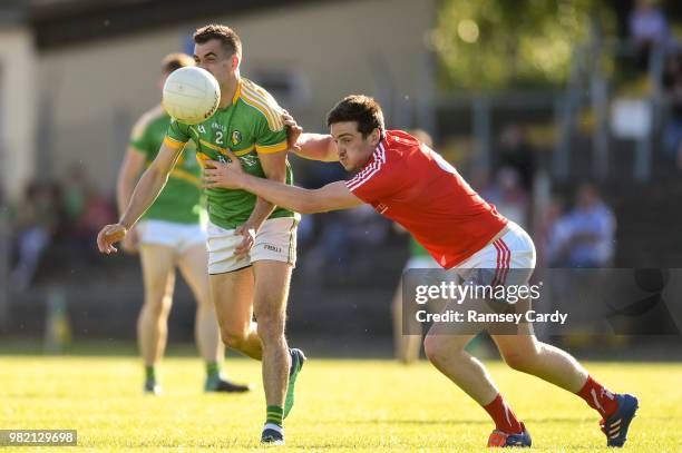 Carrick-on-Shannon , Ireland - 23 June 2018; Paddy Maguire of Leitrim is tackled by Tommy Durnin of Louth during the GAA Football All-Ireland Senior...