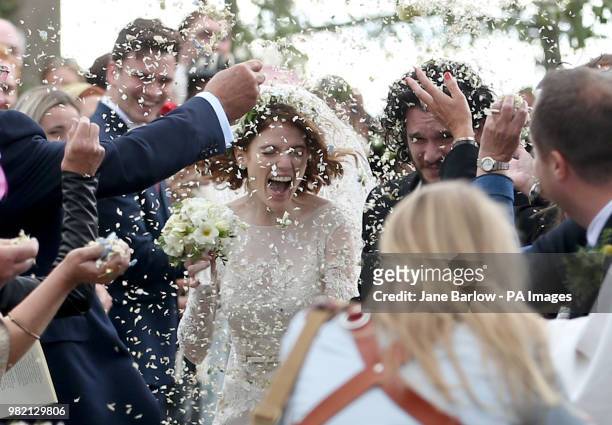 Kit Harington and Rose Leslie at Rayne Church, Kirkton of Rayne in Aberdeenshire, getting covered in confetti after their wedding.